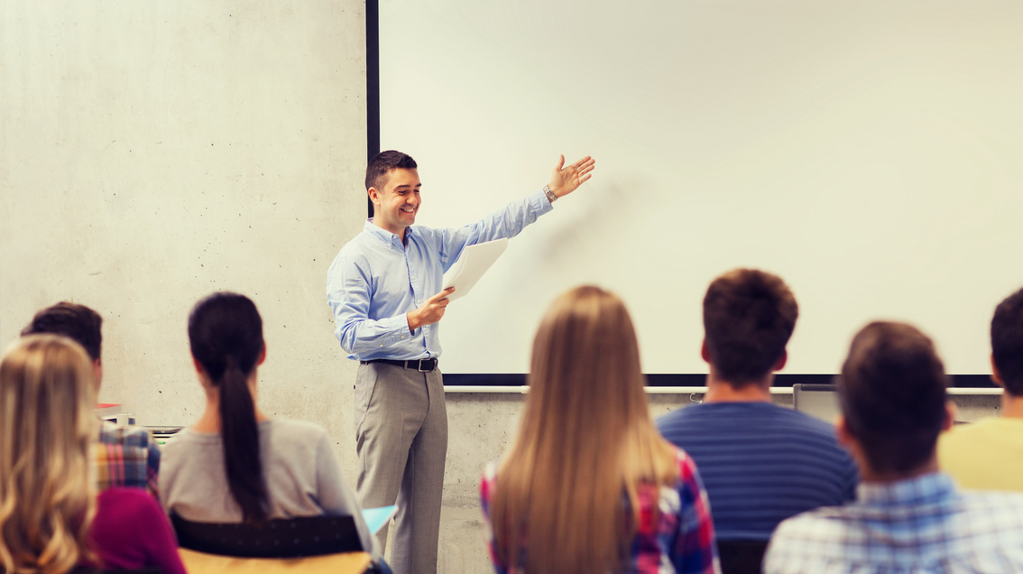 Group of Students and Smiling Teacher with Notepad